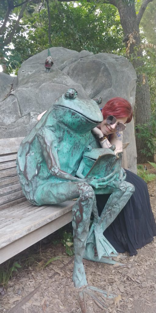 Wendy reads with a froggy friend